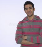 smiling-young-indian-man-portrait-against-purple-background-33897262